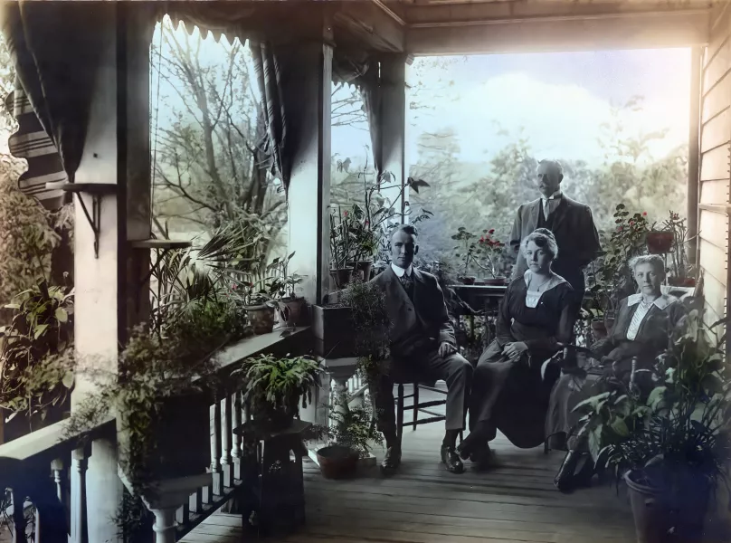 W.G. Allworden (standing), Willie Milne, Annie (Seegers) Alworden, and Bessie Milne pose on the Allworden house in Kendalltown, circa 1915