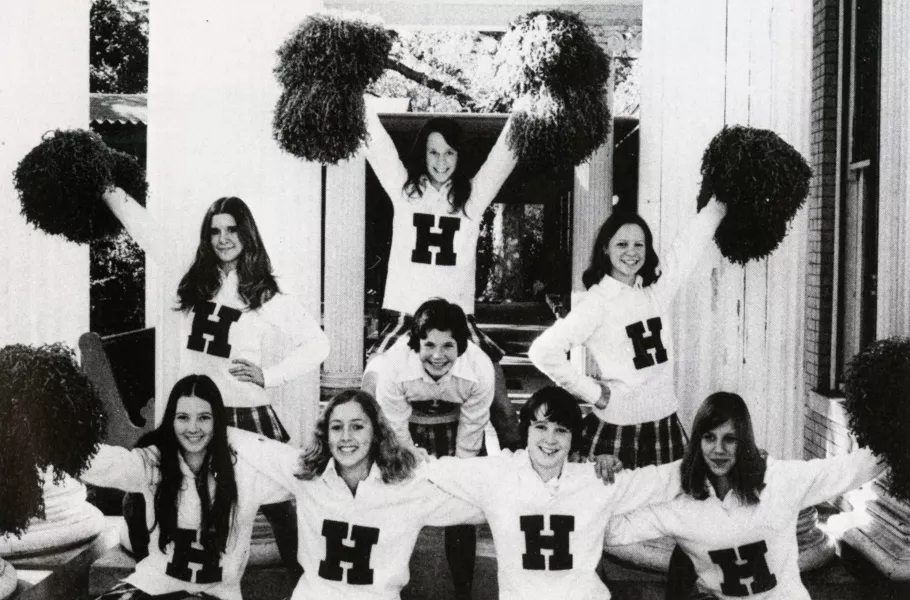 Cheerleaders pose beside the former residence's massive columns for the 1974 Highlander yearbook