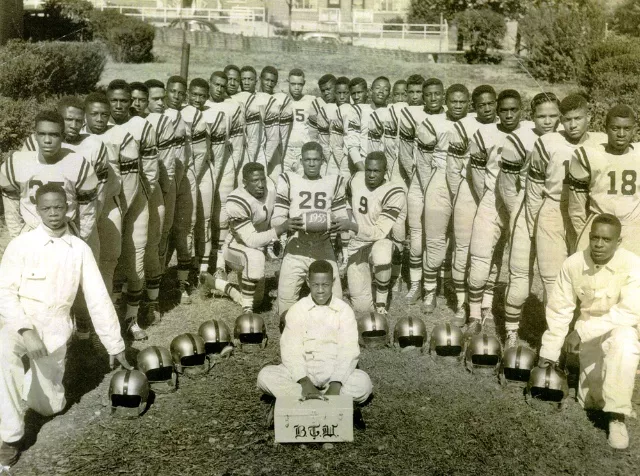 Proud members of the 1955 football team show their school spirit.  Image courtesy Booker T. Washington High School Foundation  