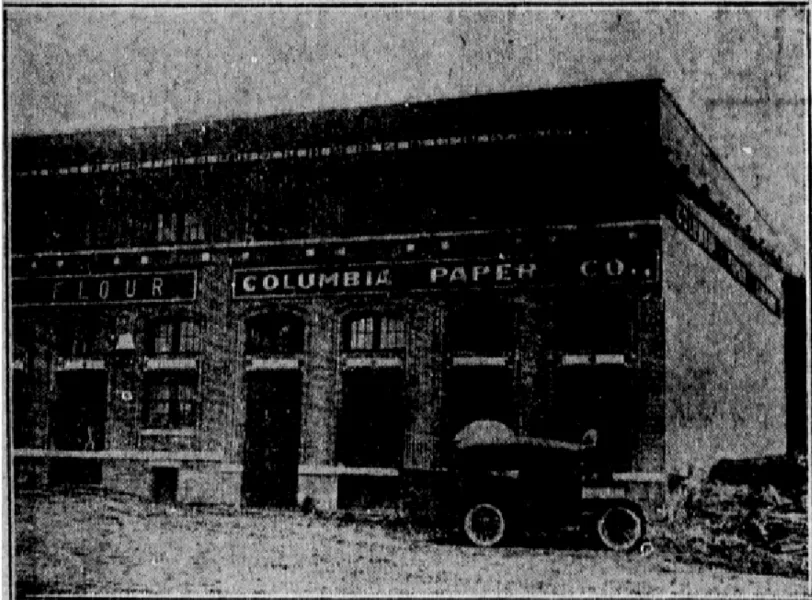 Photograph of the Columbia Paper Company's new headquarters. Note the adjacent word "Flour," indicating the southern end of Kirkland Distributing Company's portion of the warehouse. The State, October 3, 1914.
