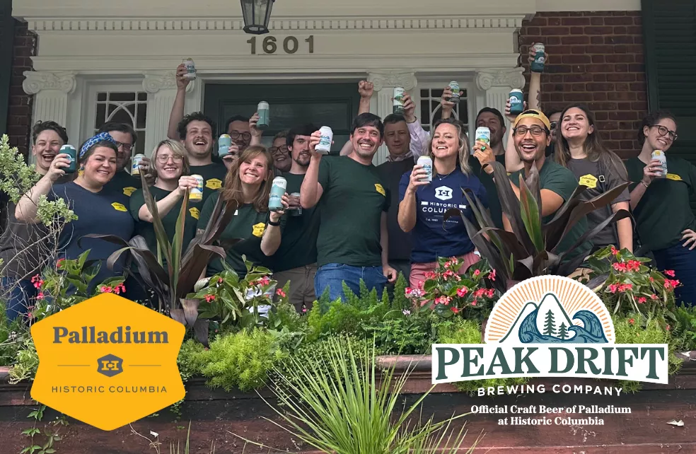 Palladium Members holding Peak Drift Beer Cans