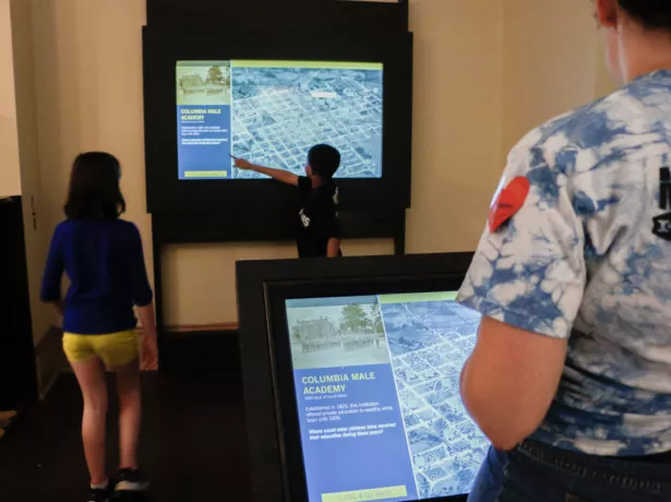 Picture of family viewing a museum display